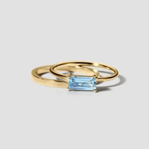 Lore Van Keer - forma vergulde dubbele ring met blauwe topaas